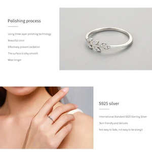 925 silver leaf ring with small diamonds, modern minimalist women’s jewelry on light background