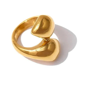 Gold ring with a unique design on a white background