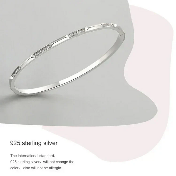 925 sterling silver bangle bracelet with geometric design and small embedded stones