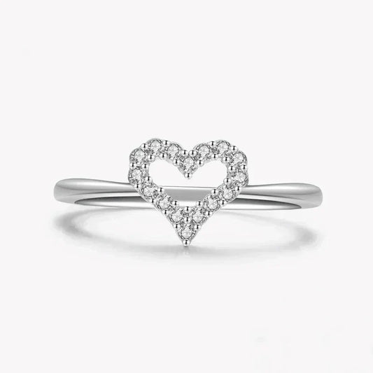 925 silver ring with open heart design and sparkling stones on a white background