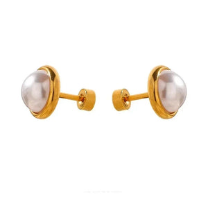 Gold-plated pearl stud earrings on white background, elegant women's jewelry