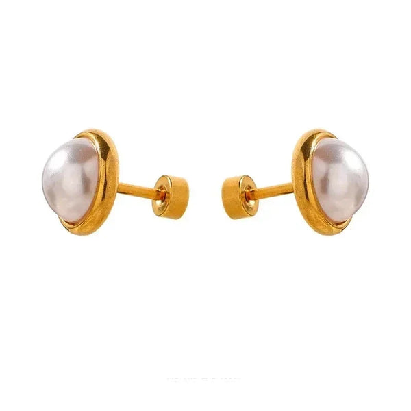 Gold-plated pearl stud earrings on white background, elegant women's jewelry