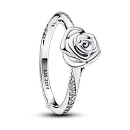 Silver ring with rose design on a white background