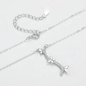Silver necklace with a bow and arrow pendant on a light gray background-Wings of Nature Necklace - TM & Co. Jewels