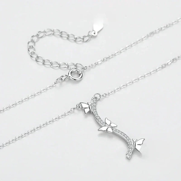 Silver necklace with a bow and arrow pendant on a light gray background-Wings of Nature Necklace - TM & Co. Jewels