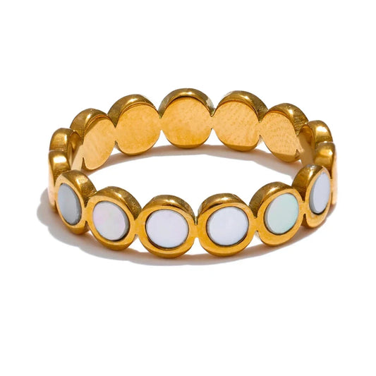 Gold and white beaded bracelet on a white background.