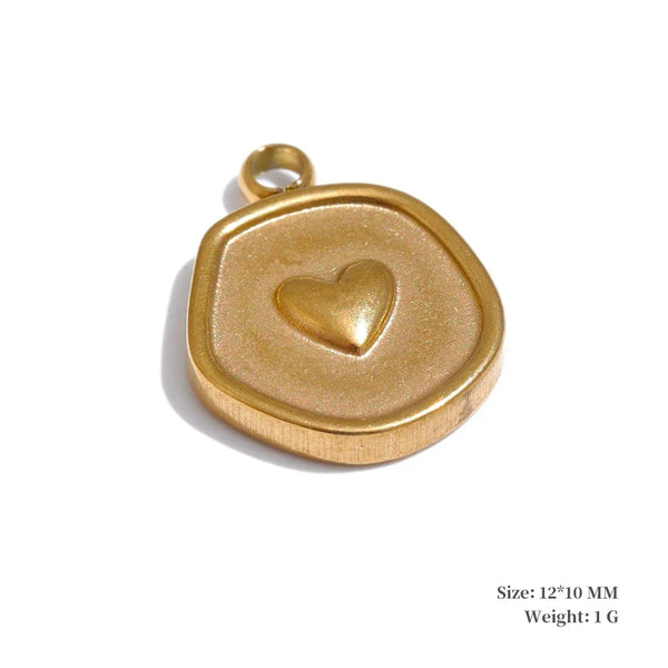 Gold pendant with a heart design on a white background