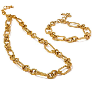 Gold chain necklace on a white background