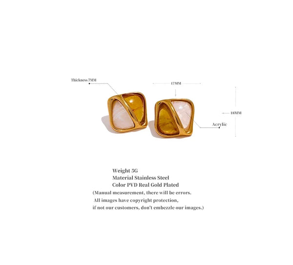 A pair of gold-plated square stud earrings with white and gold abstract inlay designs, shown with dimension.