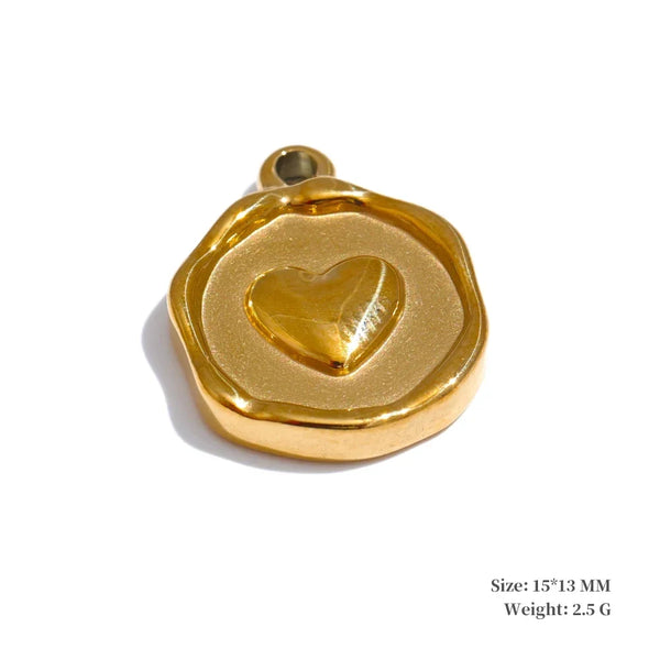 Gold pendant with a heart design on a white background