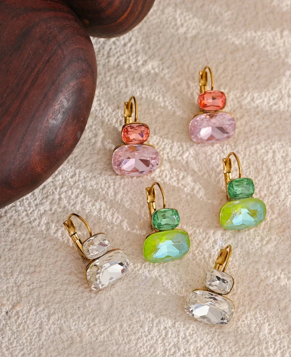 Jewellery with colorful gemstones on a textured surface