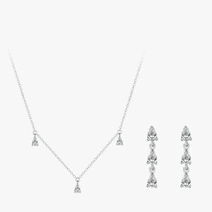 Silver necklace and earrings set on a white background