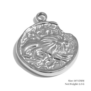 Silver pendant with detailed design on a white background