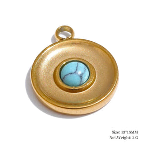 Gold pendant with a turquoise stone on a white background
