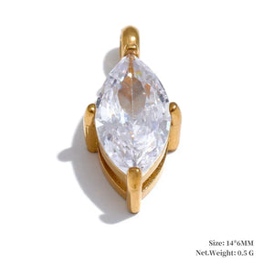 Gold pendant with a clear teardrop-shaped gemstone on a white background