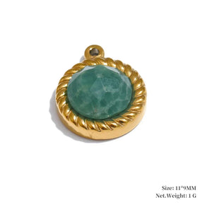 Gold pendant with a green stone on a white background
