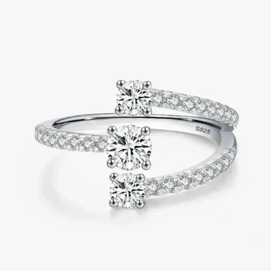Sterling silver open ring with two round-cut cubic zirconia and pavé band accents