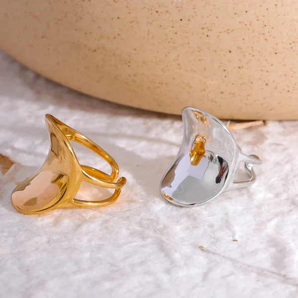 Modern wide band 18K gold-plated ring with unique open design on white background