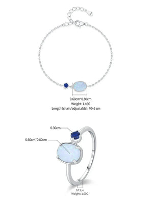 Silver chain bracelet and matching ring set with a large iridescent white opal-like stone, a small deep blue gemstone, and adjustable chain details, shown with measurement annotations on a white background.