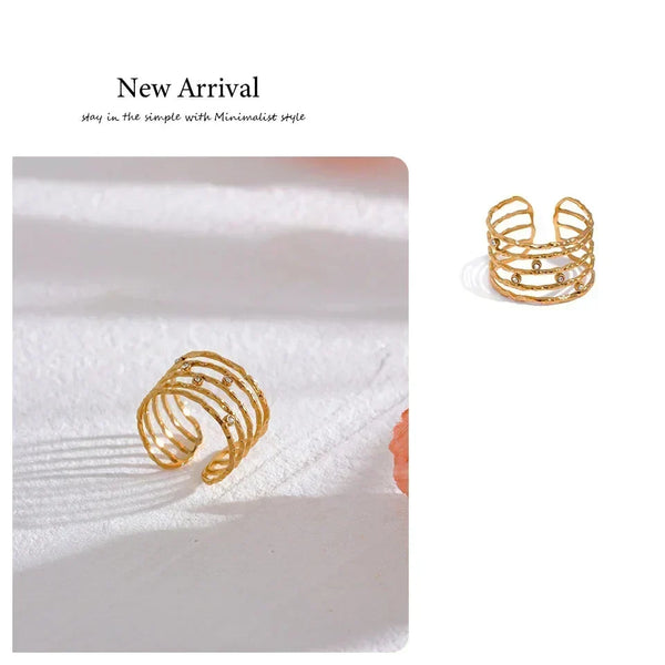 18K gold-plated open cuff ring with textured bands and small gemstone accents