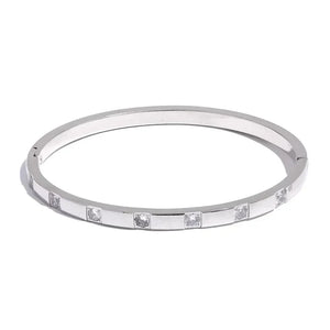 Sterling silver bangle bracelet with square set clear stones, minimalist jewelry design