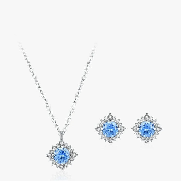 Jewelry set with blue gemstones on a white background
