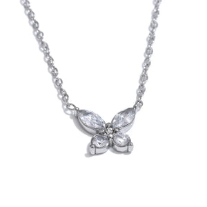 Butterfly-shaped diamond necklace on a white background