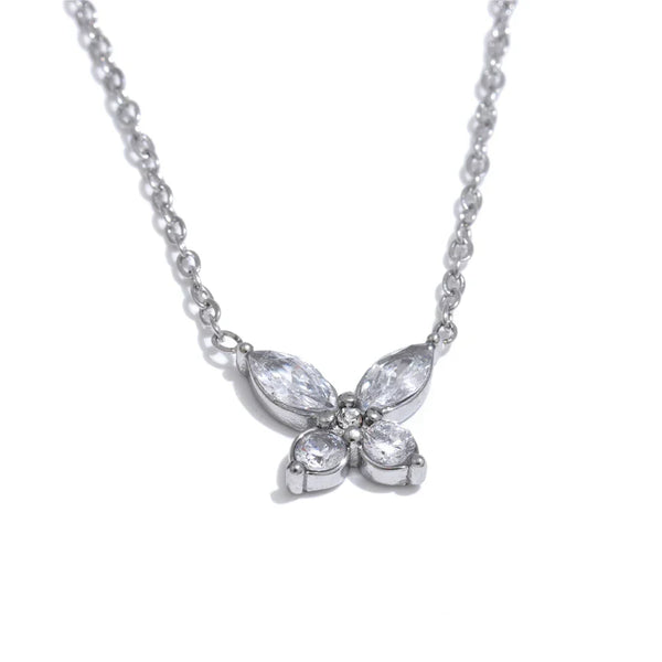 Butterfly-shaped diamond necklace on a white background