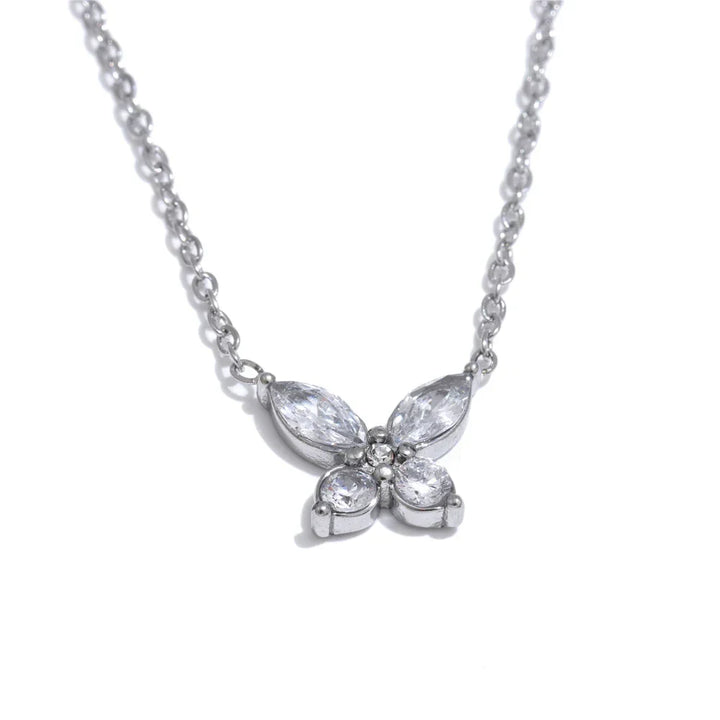 Butterfly-shaped diamond necklace on a white background