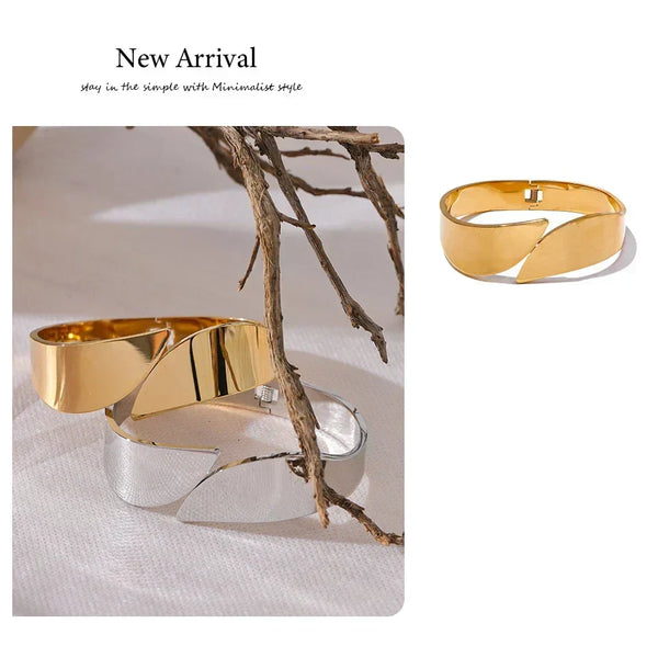 Gold and silver cuff bracelets on a neutral background with 'New Arrival' text.