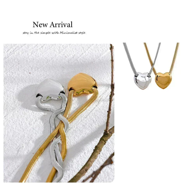 Two necklaces, one gold and one silver, on a textured white surface with 'New Arrival' text.