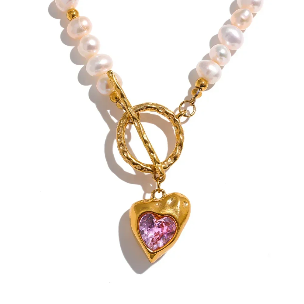 Necklace with a heart-shaped pink charm on a white background, featuring the brand 'Yulup Charm Jewelry'.