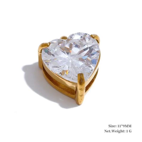 Heart-shaped diamond with gold setting on a white background