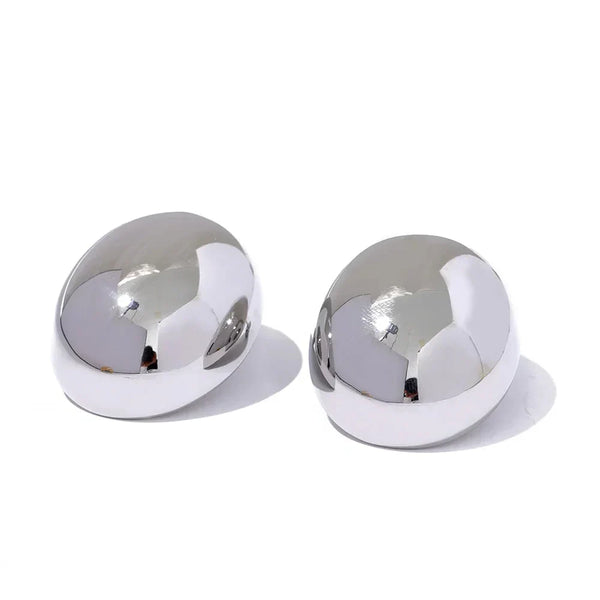 Pair of silver spherical objects on a white background