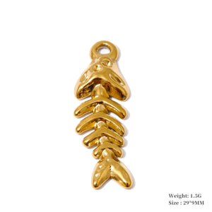 A gold-colored fish skeleton charm with a small loop at the top, shown on a plain white background with text indicating its weight and size.