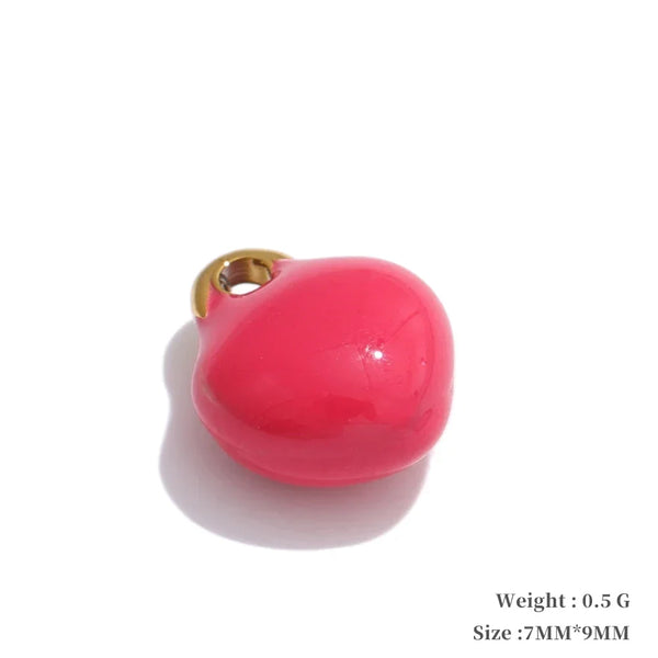 Pink heart-shaped charm with gold accent on a white background