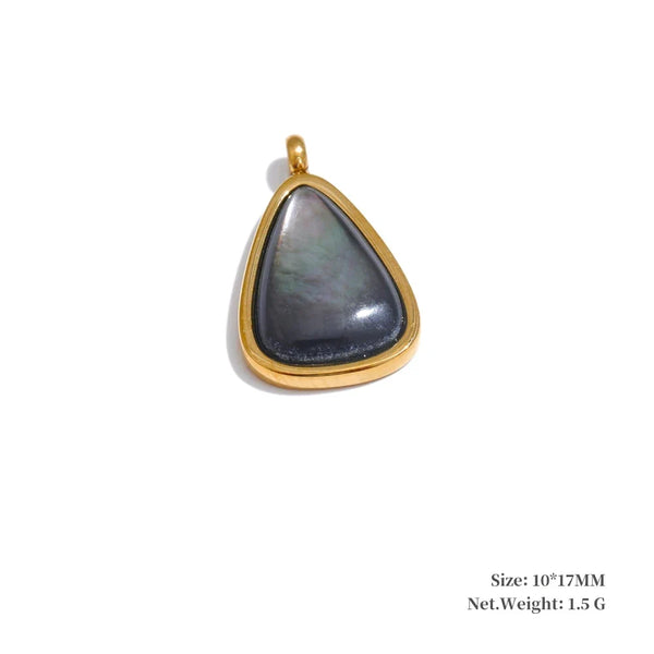 Gold pendant with a gray stone on a white background
