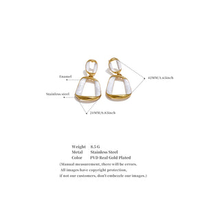 Gold and white earrings with measurement details on a white background
