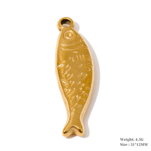 A gold-colored fish-shaped pendant with embossed scales, shown on a white background with a soft shadow. Small text in the bottom right corner lists the weight as 4.