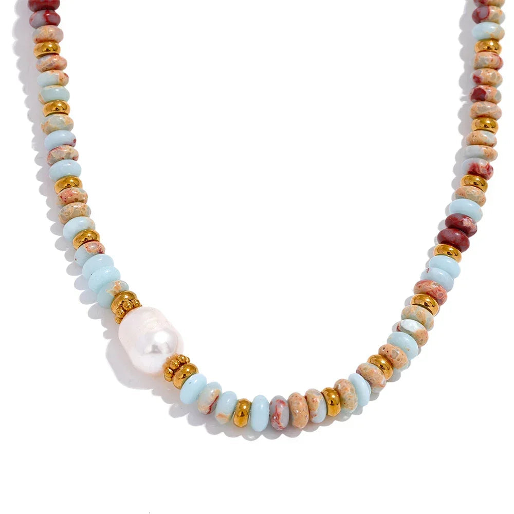 Necklace with multicolored beads and a pearl on a white background.