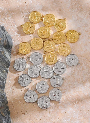 Gold and silver coins on a stone surface