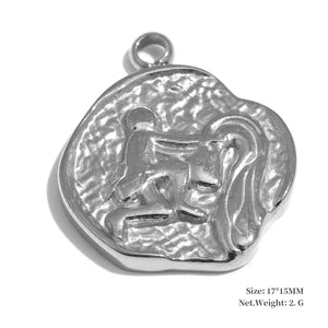 Silver pendant with a lion design on a white background