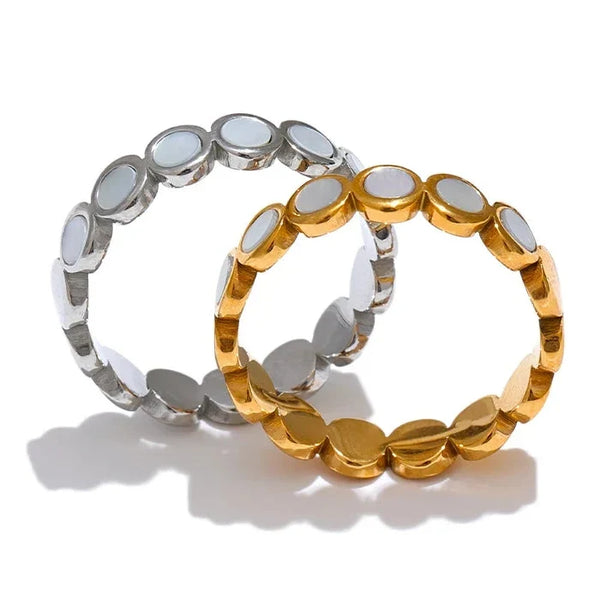 Two gold and silver bracelets on a white background