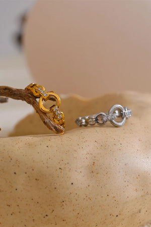 Gold and silver rings on a textured surface