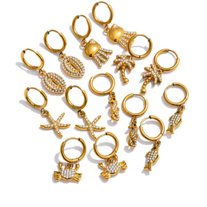 Collection of gold hoop earrings with various designs on a white background.
