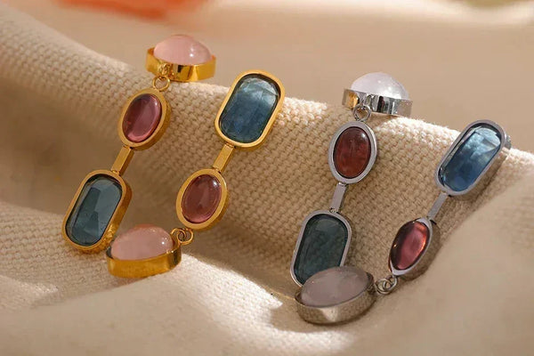 Elegant 925 Sterling Silver and 18K Gold-Plated gemstone earrings with pink, blue, and red stones.