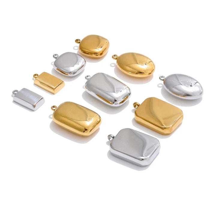 Gold and silver jewelry connectors on a white background.