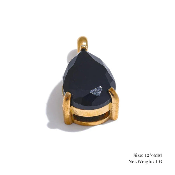 Black teardrop-shaped pendant with gold setting on a white background