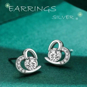 Silver earrings on a teal background with 'EARRINGS SILVER' text.