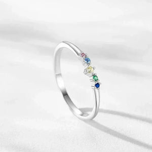 Prism Glow Stackable Ring - TM & Co. Jewels-Silver ring with multicolored gemstones on a light gray background.